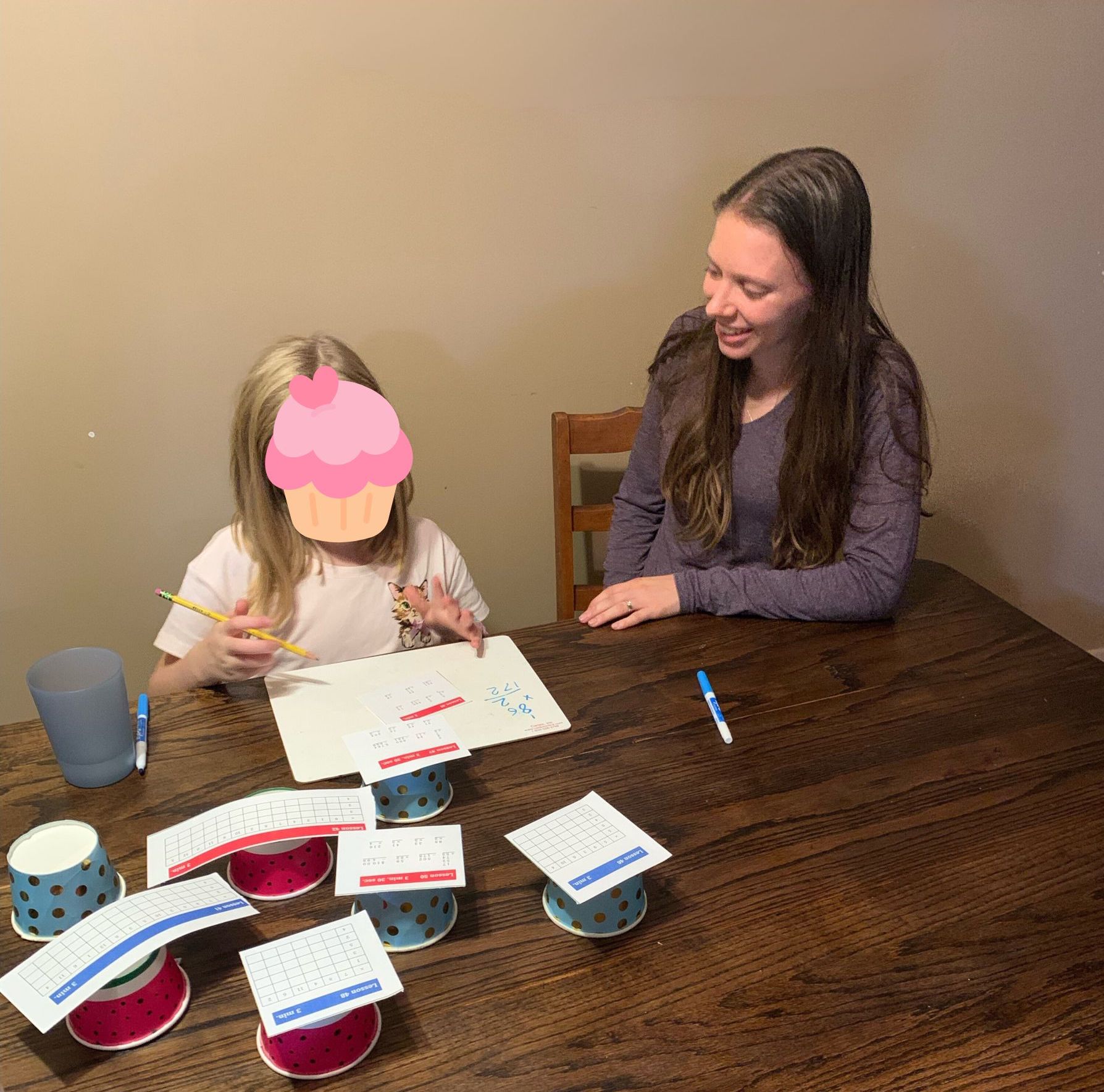 Julia Beiler teaching math to a client with a game