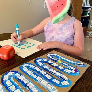 student playing a game for learning fractions