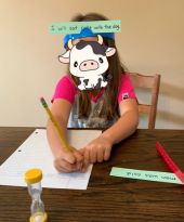 student writing sounds to learn how to sound out words